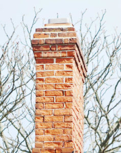 a beautiful masonry chimney in the fall
